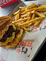 GW’s BBQ signature dishes Brisket Burger, Brisket Sandwich, Pulled Pork Sandwich.